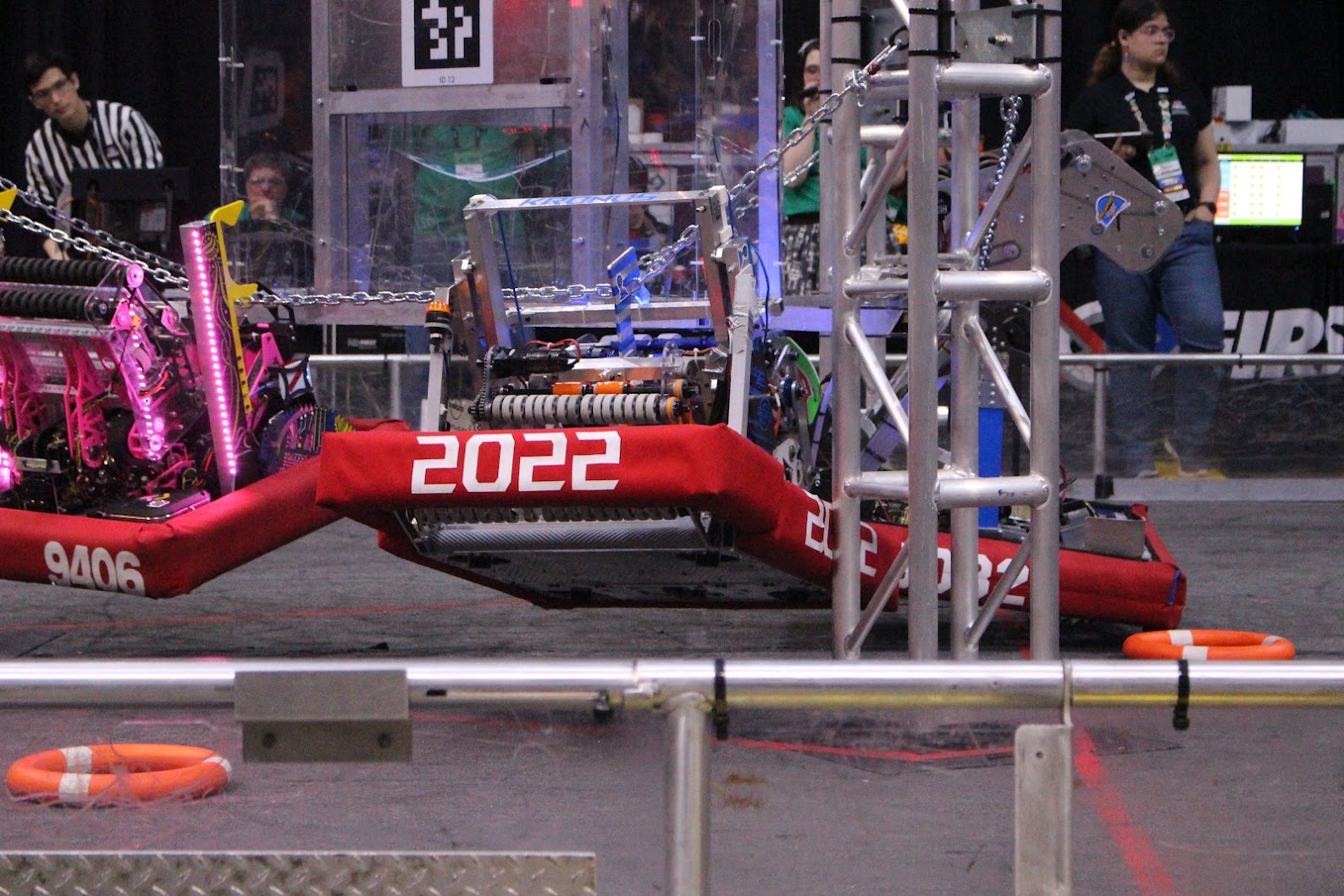 Red alliance robot hanging from its climb mechanism, 2023–24 season.